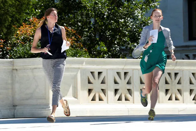 News assistants run out after the U.S. Supreme Court granted parts of the Trump administration's emergency request to put his travel ban into effect immediately while the legal battle continues, in Washington, U.S., June 26, 2017. (Photo by Yuri Gripas/Reuters)