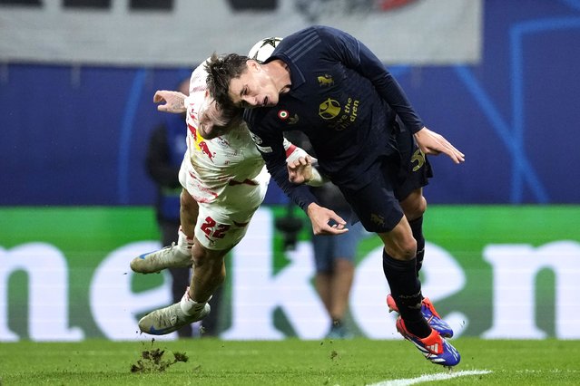 Leipzig's David Raum, left, and Juventus' Nicolo Savona go for the ball during the UEFA Champions League opening phase soccer match between Leipzig and Juventus in Leipzig, Germany, Wednesday, October 2, 2024. (Photo by Ebrahim Noroozi/AP Photo)