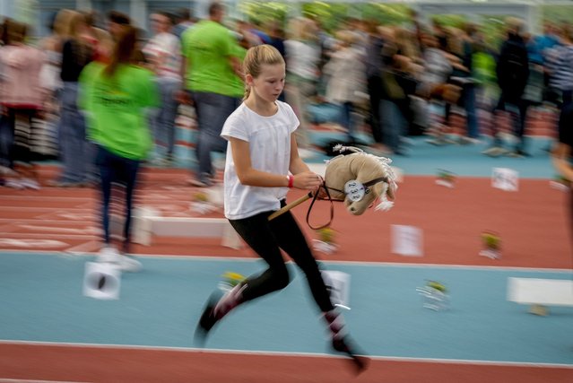 A participant competes in the dressage event at the first German Hobby Horsing Championship in Frankfurt, Germany, Saturday, September 14, 2024. (Photo by Michael Probst/AP Photo)