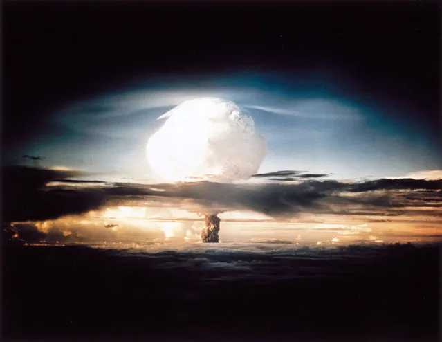 The mushroom cloud produced by the first explosion by the Americans of a hydrogen bomb at Eniwetok Atoll in the South Pacific. Known as Operation Ivy, this test represented a major step forwards in terms of the destructive power achievable with atomic weapons. The hydrogen, or fusion, bomb used a fission device similar to those dropped on Hiroshima and Nagasaki at the end of World War II, detonated inside a container containing deuterium. The high temperatures involved set off a fusion reaction in the deterium, releasing vast amounts of energy. The yield of the weapon was 10.4 megatonnes, more than the total of all the high explosive detonated in the entire duration of the Second World War. (Photo by SSPL/Getty Images)