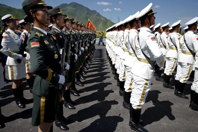 Soldiers of China's People's Liberation Army attend a training session for a military parade to mark the 70th anniversary of the end of World War Two, at a military base in Beijing, China, August 22, 2015. (Photo by Damir Sagolj/Reuters)