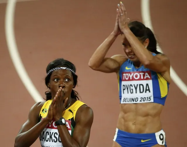 Shericka Jackson of Jamaica (L) and Nataliia Pygyda of Ukraine react after the women's 400 metres semi-final during the 15th IAAF World Championships at the National Stadium in Beijing, China August 25, 2015. (Photo by David Gray/Reuters)