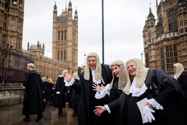 Judiciary professionals and judges pose to members of the media as they walk in procession from Westminster Abbey to the Houses of Parliament to mark the beginning of the Legal Year, in London, Britain, 01 October 2024. As a long-standing tradition to mark the beginning of the Legal Year, judges, senior judicial officers, and King's Counsel from England and Wales attend a religious service at Westminster Abbey followed by a reception at the Houses of Parliament, hosted by the Lord Chancellor, called the Lord Chancellor's breakfast. (Photo by Tolga Akmen/EPA)