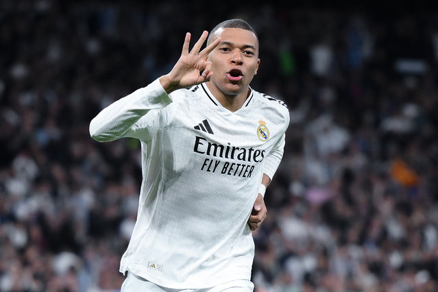Kylian Mbappe of Real Madrid celebrates scoring his team's third goal and his hat trick during the UEFA Champions League 2024/25 League Knockout Play-off second leg match between Real Madrid C.F. and Manchester City at Santiago Bernabeu Stadium on February 19, 2025 in Madrid, Spain. (Photo by David Ramos/Getty Images)
