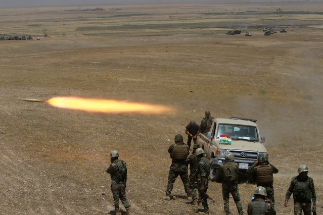 Kurdish Peshmerga forces fire a rocket toward Islamic State militants on the southeast of Mosul , Iraq, August 14, 2016. (Photo by Azad Lashkari/Reuters)
