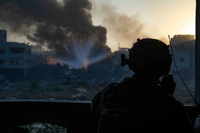 An Israeli soldier operates in the Gaza Strip in this picture released on December 29, 2023. (Photo by Israel Defense Forces via Reuters)