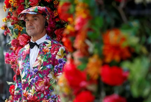 A doorman in a floral-themed suit stands at the entrance to Annabel's club, after it reopened following the coronavirus disease (COVID-19) outbreak, in London, Britain, July 5, 2020. (Photo by Peter Nicholls/Reuters)