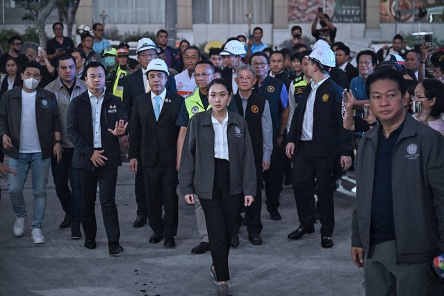 Thailand's Prime Minister Paetongtarn Shinawatra (C) arrives at a construction site where a building collapsed in Bangkok on March 28, 2025, after an earthquake. A powerful earthquake killed more than 20 people across Myanmar and Thailand on March 28, toppling buildings and bridges and trapping over 80 workers in an under-construction skyscraper in Bangkok. (Photo by Lillian Suwanrumpha/AFP Photo)