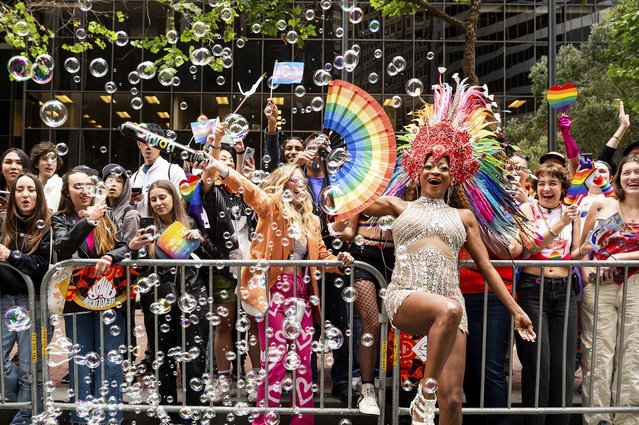 Revelers celebrate during San Francisco's Pride Parade on Sunday, June 25, 2023. (Photo by Noah Berger/AP Photo)