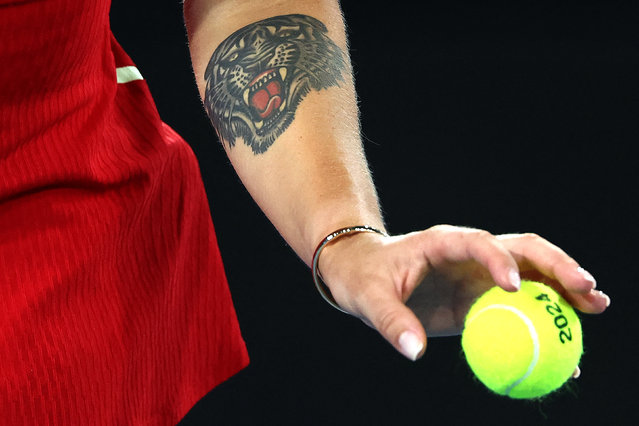 Belarus' Aryna Sabalenka serves against USA's Amanda Anisimova during their women's singles match on day eight of the Australian Open tennis tournament in Melbourne on January 21, 2024. (Photo by David Gray/AFP Photo)