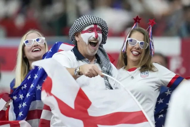 US and England supporters cheer their teams prior to the start of the World Cup group B soccer match between England and The United States, at the Al Bayt Stadium in Al Khor, Qatar, Friday, November 25, 2022. (Photo by Ashley Landis/AP Photo)