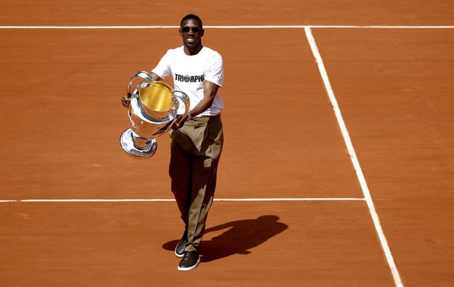 PSG player player Ousmane Dembele poses with the UEFA Champions League trophy on Court Philippe-Chatrier at the French Open Grand Slam tennis tournament at Roland Garros in Paris, France, 02 June 2025. Paris Saint-Germain won the UEFA Champions League for the first time in the club's history after beating Internazionale Milano on 31 May 2025 in the final in Munich. (Photo by Yoan Valat/EPA/EFE)