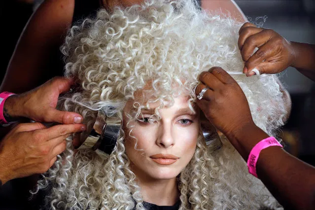 A model has a wig prepared backstage before The Blonds Spring/Summer 2017 collection during New York Fashion Week in the Manhattan borough of New York, U.S., September 11, 2016. (Photo by Lucas Jackson/Reuters)