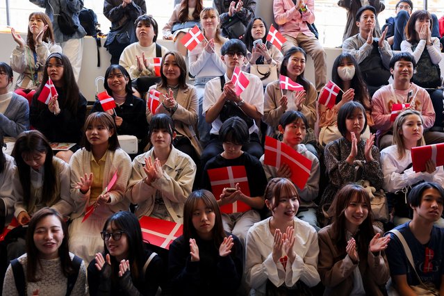 Attendees hold Danish national flag at the official opening of the Danish National Day at Expo 2025 in Osaka, Japan on April 24, 2025. (Photo by Kim Kyung-Hoon/Reuters)
