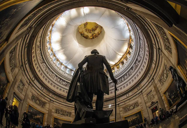 The Architect of the Capitol briefs assembled press on the progress of the U.S. Capitol Dome Restoration Project on November, 18, 2014 in Washington, DC. Pictured, a view of the interior of the Rotunda, showing the protection beneath the dome during construction. 
(Photo by Bill O'Leary/The Washington Post)