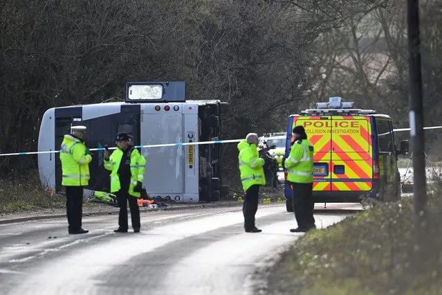 Police attend the scene of a bus crash near Cannington, Britain on January 17, 2023. (Photo by Toby Melville/Reuters)