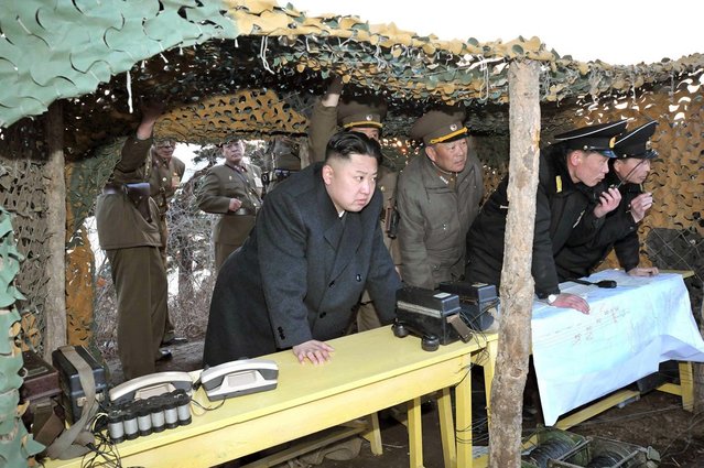 Kim Jong Un inspects landing and anti-landing drills at an undisclosed location on North Korea's east coast. (Photo by AFP Photo/KCNA via KNS)