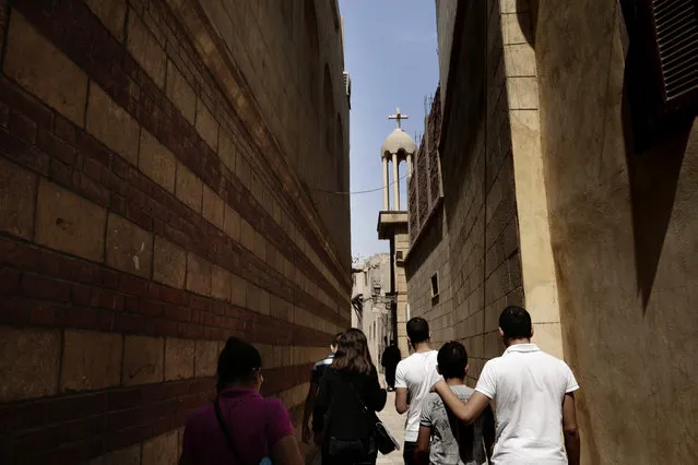 Egyptians walk in a Christian neighborhood in Old Cairo, Egypt, Tuesday, August 30, 2016. (Photo by Nariman El-Mofty/AP Photo)