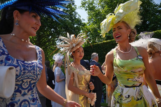 Ladies arrive wearing ornate hats on the third day of the Royal Ascot horse race meeting, traditionally called Ladies Day, at Ascot, England, Thursday, June 19, 2025. (Photo by Kin Cheung/AP Photo)