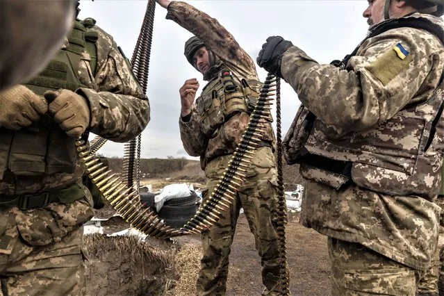 Members of the Ukrainian territorial defence force head out to a firing range in the countryside south of Kyiv on February 26, 2023, to test out some recently delivered American arms. (Photo by Jack Hill/The Times)