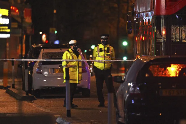 The scene at Edmonton Police Station in Enfield, north London, where a man has been arrested after a vehicle collided with the station office, Wednesday, November 11, 2020. There were no injuries reported, and it was unclear how the crash occurred. (Photo by Kirsty O'Connor/PA Wire via AP Photo)