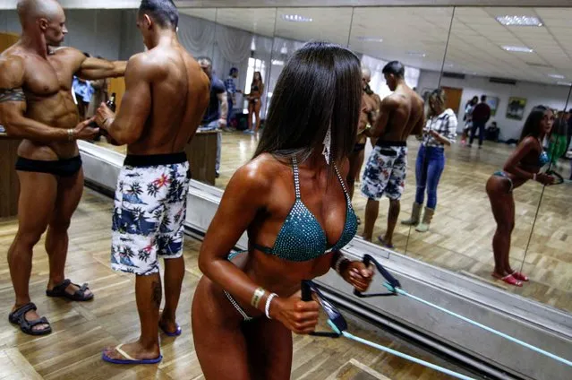 Body builders preparing at the backstage during the Bodybuilding Cup in Kiev, Ukraine on November 7, 2015 which includes classic bodybuilding, physicist and body fitness and bikini in the competition. (Photo by Nazar Furyk/Pacific Press)