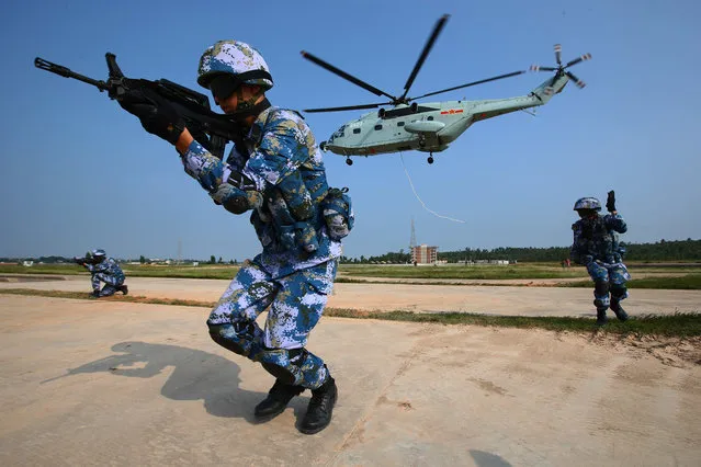 In this photo released by Xinhua News Agency, marines take part in a joint naval drill in Zhanjiang, south China's Guangdong Province, Tuesday September 13, 2016. China and Russia started “Joint Sea 2016” drill off Guangdong Province in the South China Sea on Tuesday. (Photo by Zha Chunming/Xinhua via AP Photo)