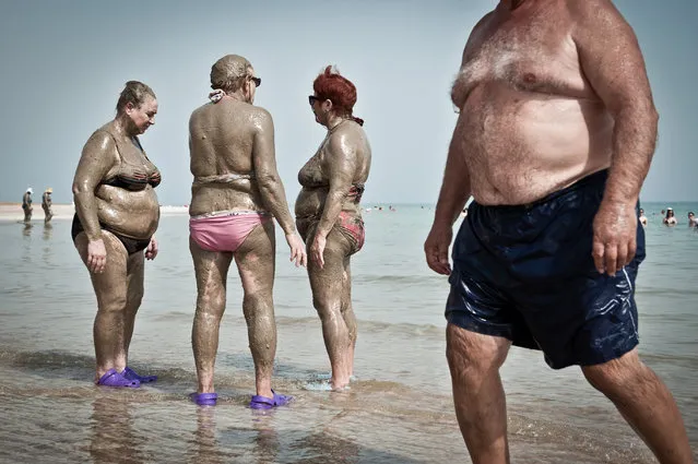 Seekers of eternal youth coat themselves in mineral-rich mud, at the Dead Sea. Photo location: Israel. (Photo and caption by Nick Riley/National Geographic Photo Contest)