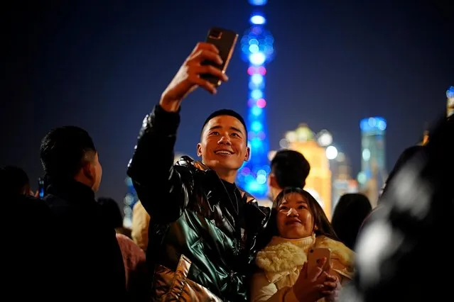 People gather to celebrate the arrival of the New Year near the Bund during the coronavirus disease (COVID-19) outbreak in Shanghai, China on December 31, 2020. (Photo by Aly Song/Reuters)