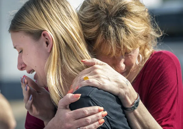 Santa Fe High School student Dakota Shrader is comforted by her mother Susan Davidson following a shooting at the school on Friday, May 18, 2018, in Santa Fe, Texas. Shrader said her friend was shot in the incident. (Photo by Stuart Villanueva/The Galveston County Daily News via AP Photo)