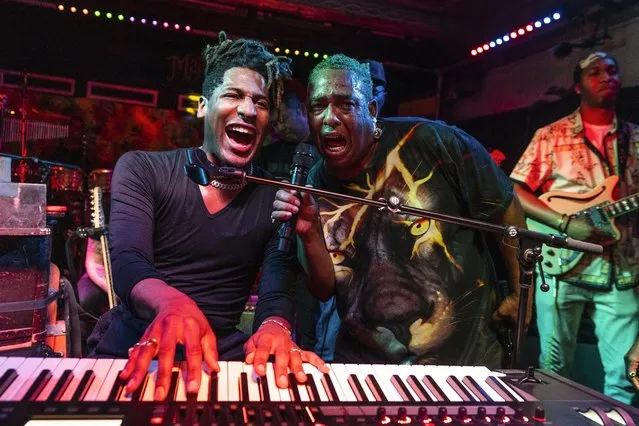 (L-R) Jon Batiste and Russell Batiste perform on the sidelines of the 2023 New Orleans Jazz & Heritage Festival at the Maple Leaf Bar on May 02, 2023 in New Orleans, Louisiana. The surprise show was announced in the morning on the artist's social media accounts. (Photo by Erika Goldring/Getty Images)