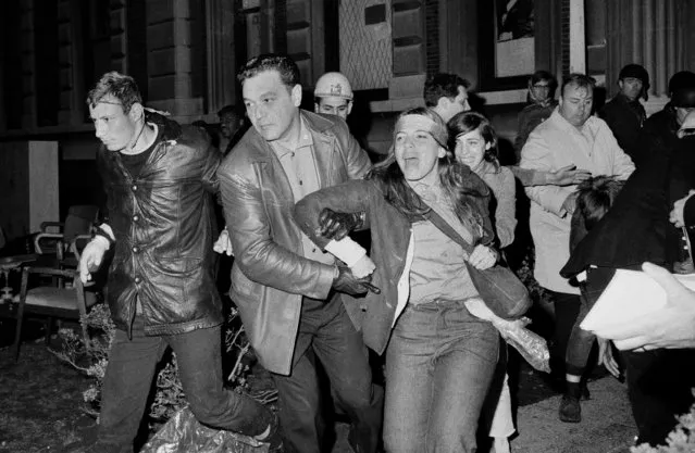 In this April 30, 1968 file photo, a student protester at Columbia University is forcibly removed from the campus by plainclothes New York City police after they entered buildings occupied by the students, and ejected those participating in the sit-ins. Fifty years ago, more than 700 protesters were arrested and more than 130 were injured when police retook the occupied buildings, during what was part of a year of global turmoil. (Photo by Dave Pickoff/AP Photo)