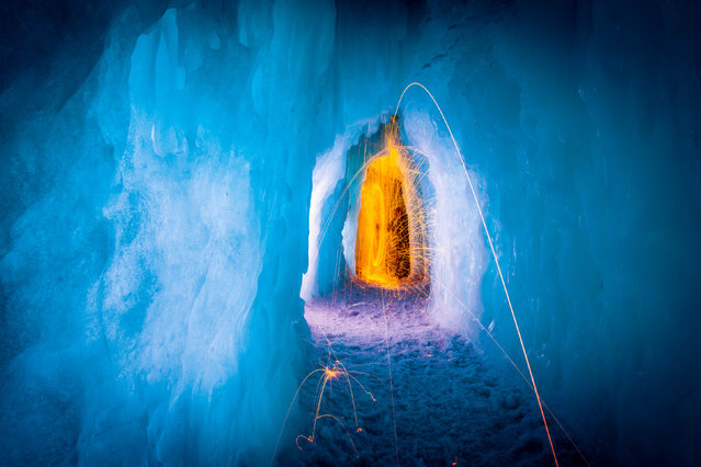 Fire in the ice castle. (Photo by Sam Scholes/Caters News)
