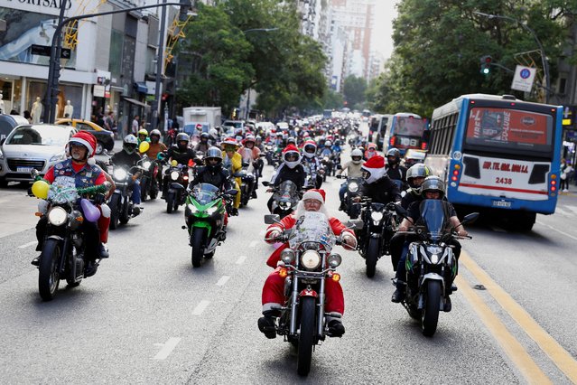 A man dressed as Santa Claus and others ride motorcycles before delivering gifts to hospitalized children in Buenos Aires, Argentina, on December 21, 2024. (Photo by Francisco Loureiro/Reuters)