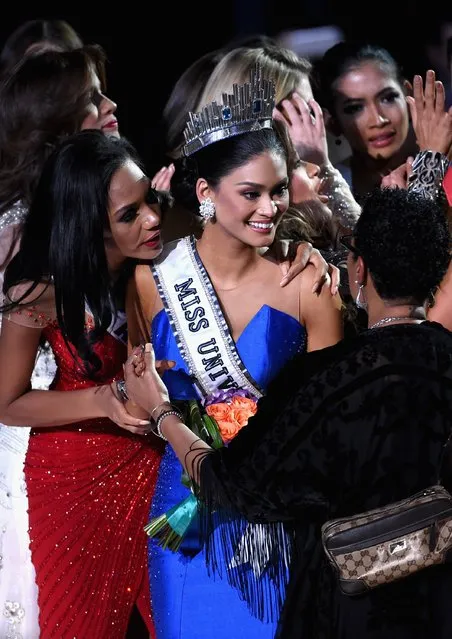 Miss Philippines 2015, Pia Alonzo Wurtzbach (C), who was mistakenly named as First Runner-up reacts with other contestants after being named the 2015 Miss Universe during the 2015 Miss Universe Pageant at The Axis at Planet Hollywood Resort & Casino on December 20, 2015 in Las Vegas, Nevada. (Photo by Ethan Miller/Getty Images)