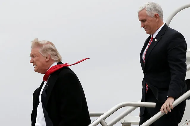 U.S. President-elect Donald Trump and Vice-President elect Mike Pence walk off Trump's plane upon their arrival in Indianapolis, Indiana, U.S., December 1, 2016. (Photo by Mike Segar/Reuters)