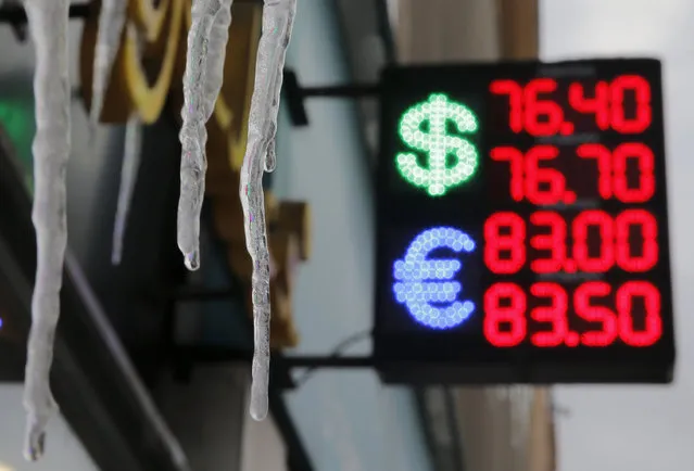 Icicles hang near a board showing currency exchange rates of the U.S. dollar and euro against the rouble in Moscow, Russia January 14, 2016. (Photo by Maxim Shemetov/Reuters)