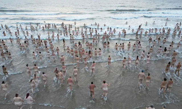 Thousands brave the North Sea and take part in the North East Skinny Dip at Druridge Bay on the North Sea in Northumberland, UK on Sunday, September 24, 2023. (Photo by Owen Humphreys/PA Images via Getty Images)