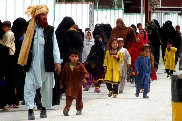 Internally displaced tribal people return to  their villages cleared by the Pakistani army, in Bannu, Pakistan, Tuesday, March 31, 2015. Thousands of families are displaced from Pakistani tribal areas in North Waziristan along the Afghan border as the Pakistani army launched crackdown operations against Taliban and militants. (Photo by Ijaz Muhammad/AP Photo)