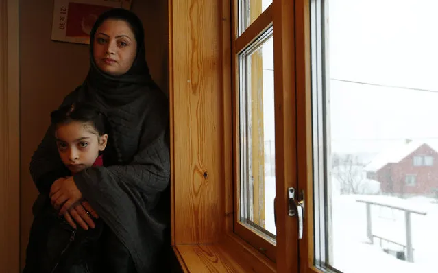 In this photo taken Tuesday, February 2, 2016, Afghan asylum seekers Sufya Nawabi, her daughter Helanar, pose for a photograph as they speak to the Associated Press in her temporary apartment at the Altnes camp on the island of Seiland, northern Norway. (Photo by Alastair Grant/AP Photo)