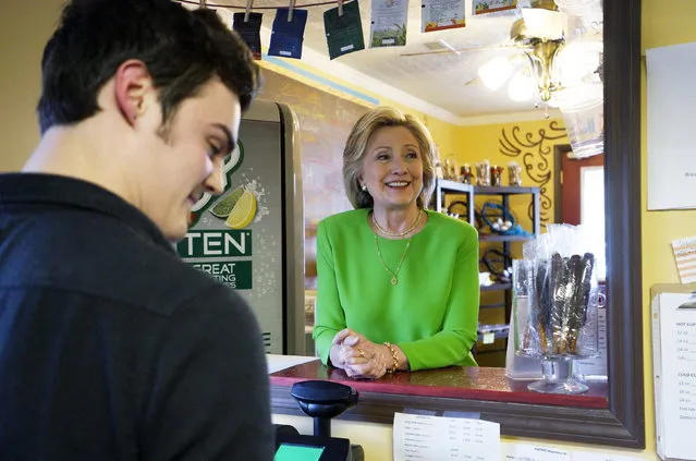 Former Secretary of State Hillary Clinton talks with local residents as she campaigns at the Jones Street Java House in LeClaire, Iowa April 14, 2015. (Photo by Rick Wilking/Reuters)