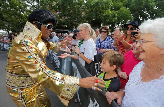 'Bollywood Elvis' Alfred Vaz greets the crowd during a street parade at the 25th annual Parkes Elvis Festival in the rural Australian town of Parkes, west of Sydney, January 14, 2017. (Photo by Jason Reed/Reuters)