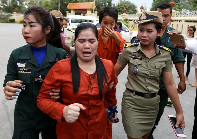 Land-rights activist Tep Vanny (C) cries as she arrives at the Supreme Court in Phnom Penh, Cambodia, January 25, 2017. (Photo by Samrang Pring/Reuters)