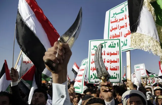 Houthi supporters attend a protest against the United States-led airstrikes on Friday, January 12, 2024, in Sanaa, Yemen. The U.S. and British militaries bombed more than a dozen sites used by the Iranian-backed Houthis. The military targets included air defense and radar sites, drone and missile storage and launching locations. (Photo by AP Photo)
