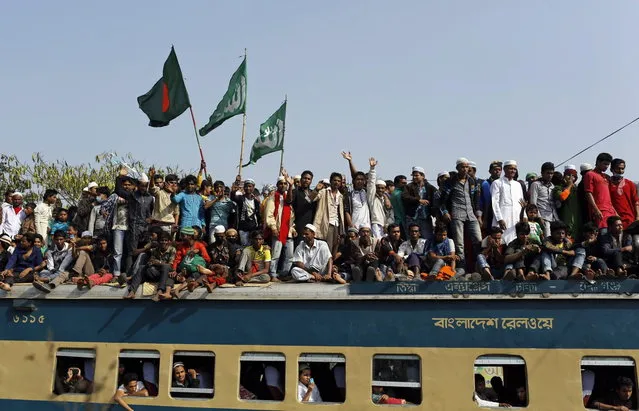 Bangladeshi Muslim devotees head to their homes in an over-crowded train after attending three-day Islamic Congregation on the banks of the River Turag in Tongi, 20 kilometers (13 miles) north of the capital Dhaka, Bangladesh, Sunday, January 26, 2014. (Photo by A. M. Ahad/AP Photo)