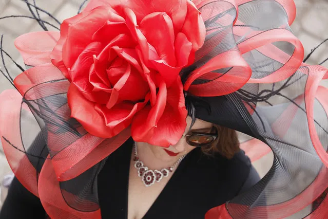 A woman wears a hat before the 145th running of the Kentucky Derby horse race at Churchill Downs Saturday, May 4, 2019, in Louisville, Ky. (Photo by John Minchillo/AP Photo)