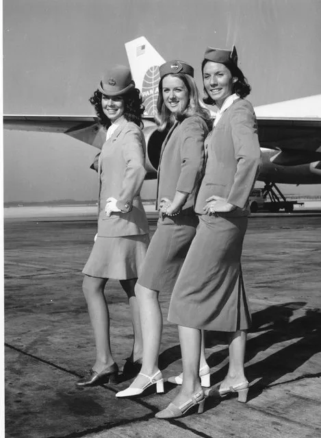 Pan American Airways stewardesses displaying the airline's uniform through the decades at London Airport in September 1971. From left to right, Jan Vinson wearing the 1970 uniform, Monica Yarry in 1960 uniform and Frances Chadick in the 1950 uniform. (Photo by Keystone/Getty Images)