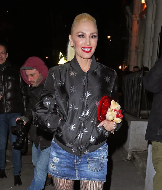 Gwen Stefani spotted leaving a restaurant where she was celebrating with her hairstylist Danilo Dixon for his birthday in New York City, New York, USA on February 14, 2017. When Gwen leaves the restaurant a fan gives her a box of chocolates with a teddy bear for Valentine's Day, he also gives Danilo a pack of donuts for his birthday and you can see Gwen taking a picture with the fan. (Photo by Andrew Rocke/Splash News)