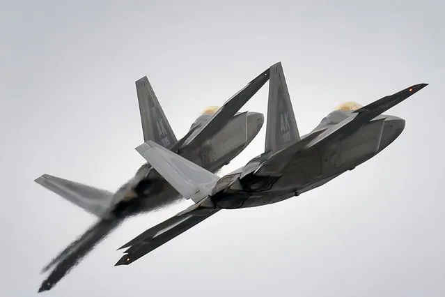 Two F-22 Raptor fighter jets from the 3rd Wing at Joint Base Elmendorf-Richardson, Alaska, conduct approach training, in this U.S. Air Force picture taken March 24, 2016. (Photo by Justin Connaher/Reuters/U.S. Air Force)