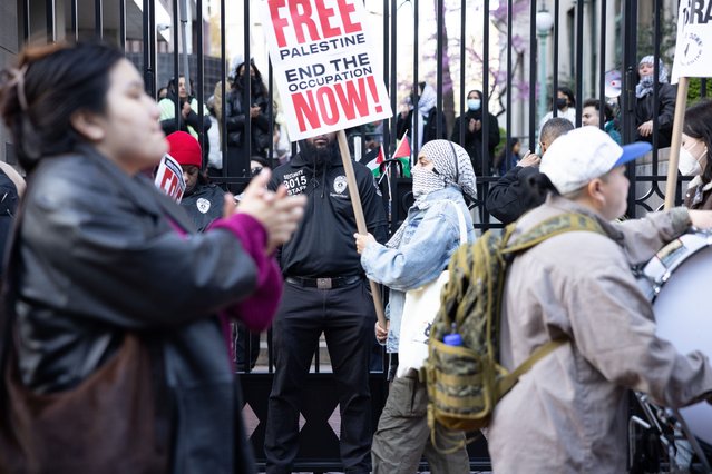 Pro-Palestine demonstrators are gathering in protest both inside and outside the locked gates of the Columbia University campus in New York City, USA, on April 23, 2024. Students who are standing on Columbia's main quad are facing the public street through the locked gate and are using megaphones to lead the crowd assembled outside in chants. Campus security has been tight since the ''Gaza Solidarity Encampment'' protest standoff began a week ago. Since only those with university ID--and members of the media during certain hours of the day--are allowed on campus, additional groups of protesters from outside the Columbia community are often forming on the public streets next to the main quad. Tensions remain high days after Columbia University President Nemat ''Minouche'' Shafik called the NYPD onto the college campus on April 18, 2024, to arrest scores of pro-Palestine students who refused to dismantle protest encampments on the main campus quad. The standoff and arrests occurred after President Shafik had faced questions before Congress regarding campus antisemitism and enforcement of rules against protests. The demonstrators are demanding divestment from Israel amid the ongoing Israel-Gaza War. (Photo by Melissa Bender/NurPhoto/Rex Features/Shutterstock)